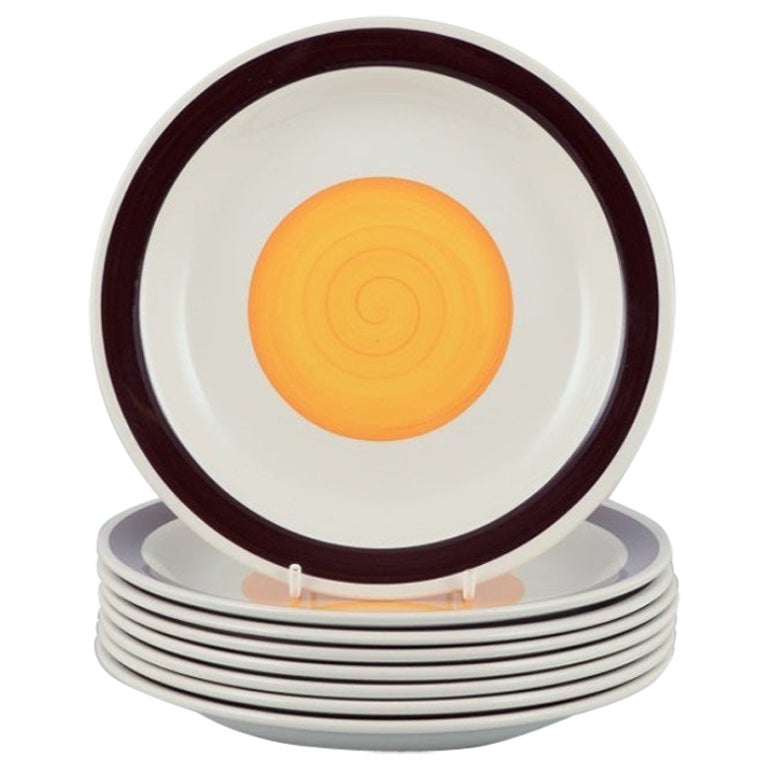 Carl Harry Stålhane for Rörstrand. Set of eight "Solöga" (Sun Eye) plates.