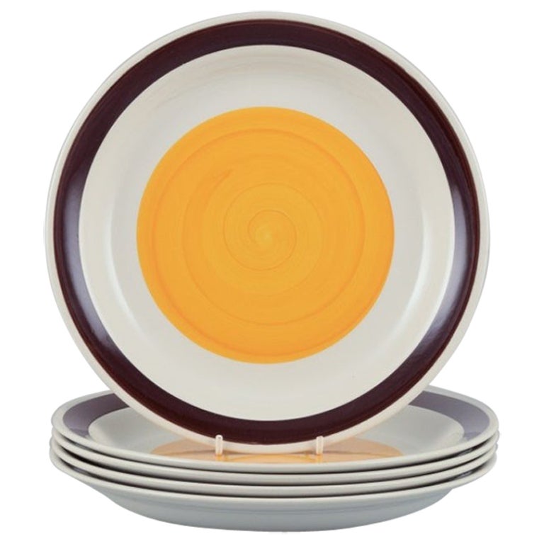 Carl Harry Stålhane for Rörstrand. Five deep "Solöga" (Sun Eye) dinner plates.