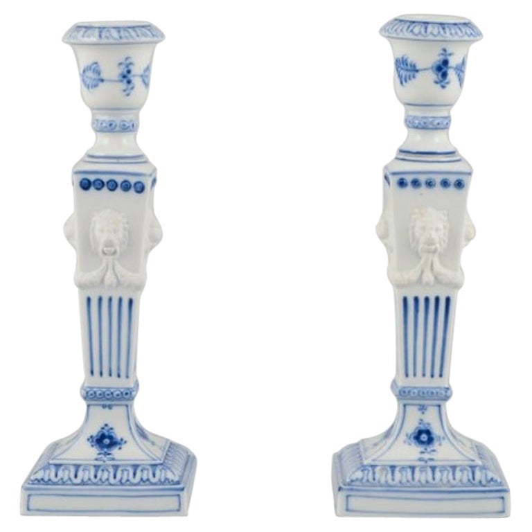 Royal Copenhagen, pair of Blue Fluted candlesticks in porcelain. For Sale