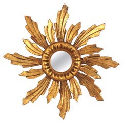 Specchio barocco spagnolo a raggiera in legno dorato intagliato