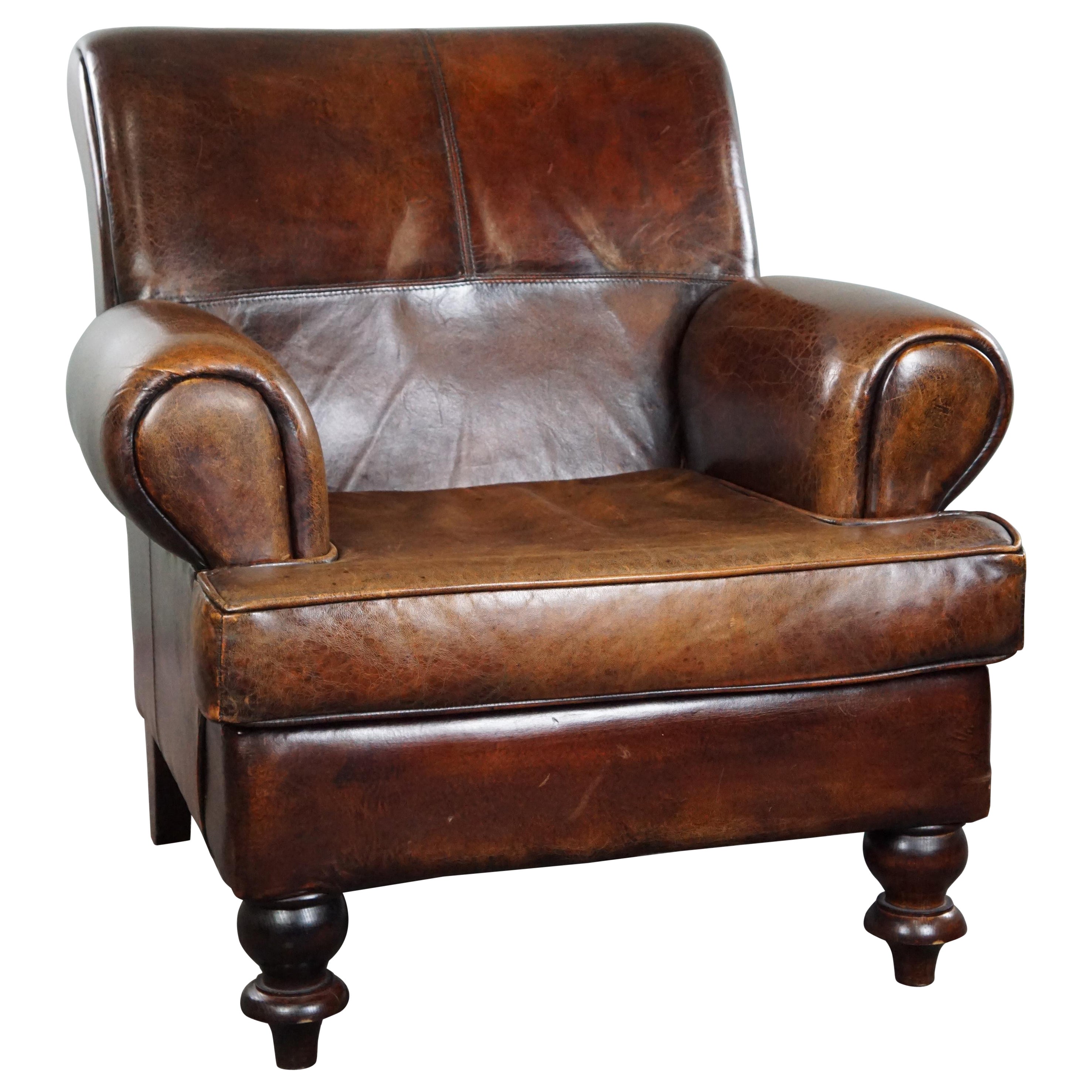 Spacious sheepskin armchair with a relaxed deep seat For Sale