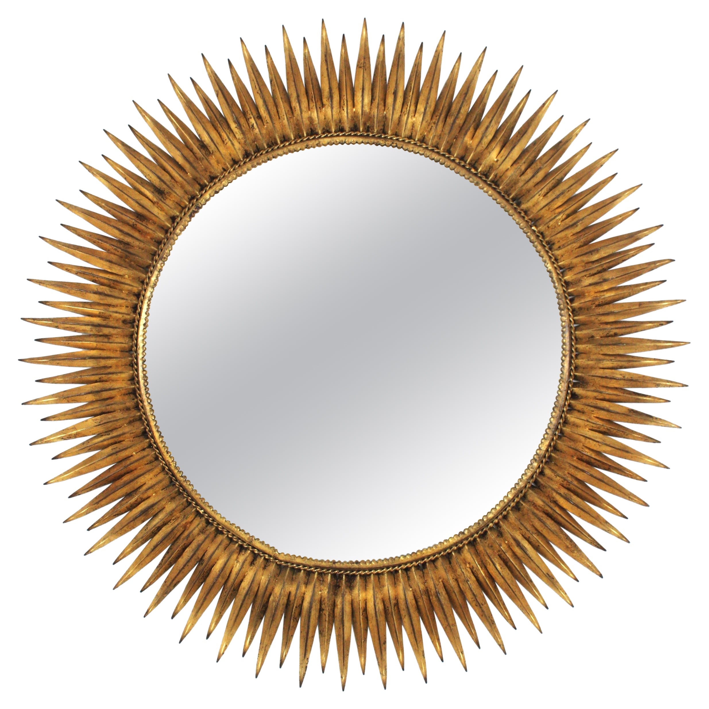 Grand miroir espagnol Sunburst en fer forgé doré en vente