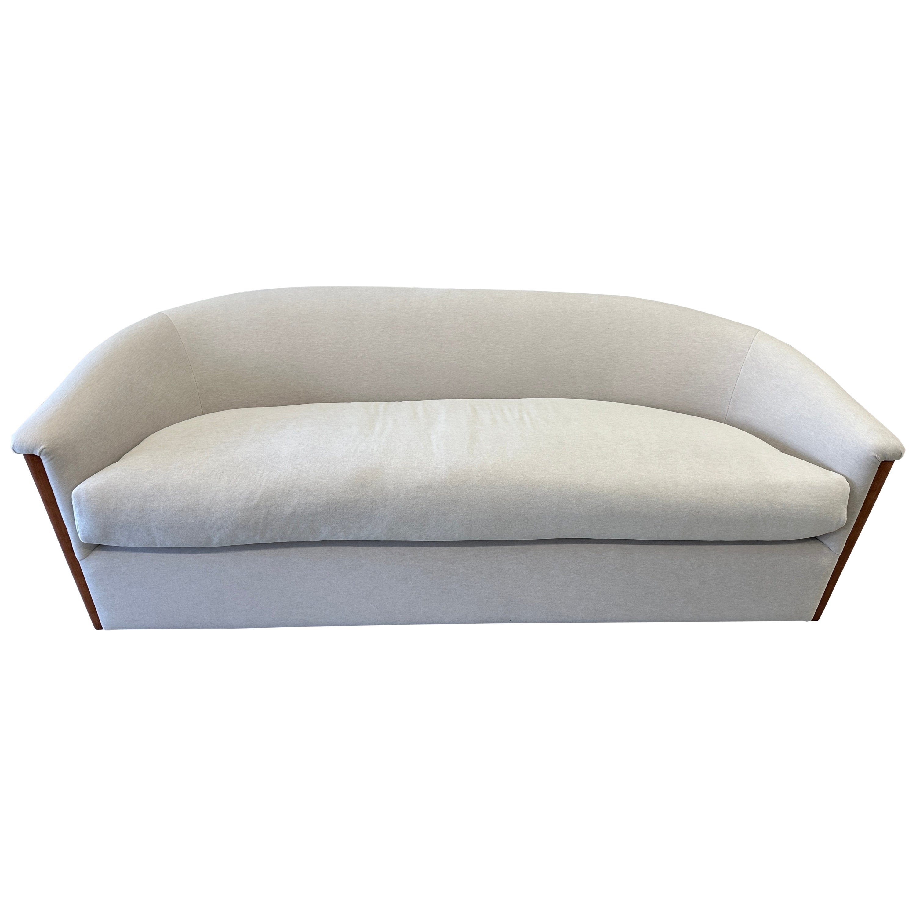 A beautiful and extremely comfortable sofa by Sally Siskin Lewis , J Robert Scott. We have had it redone in a sumptuous Mario Sirtori Alpaca/Cotton/Wool/Poly blend fabric hat is so soft to the touch. The cushion is down and soft and giving. The wood