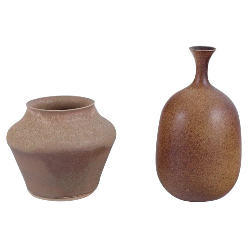 European studio ceramicist. Two unique ceramic vases. Glaze in sandy tones.  For Sale