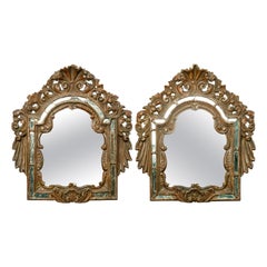 Rare paire de miroirs anciens italiens en bois doré