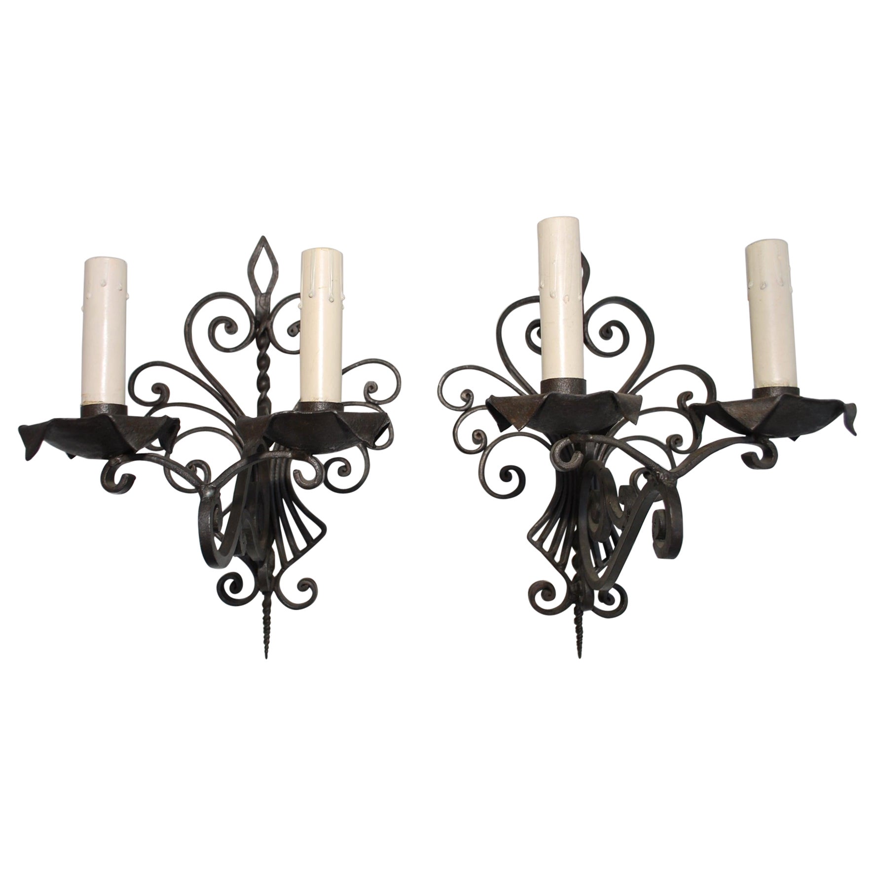 Elegant pair of French 1930's wrought iron sconces For Sale