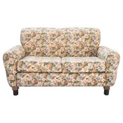 2-seater sofa, floral fabric, wooden frame, plastic feet and woodn