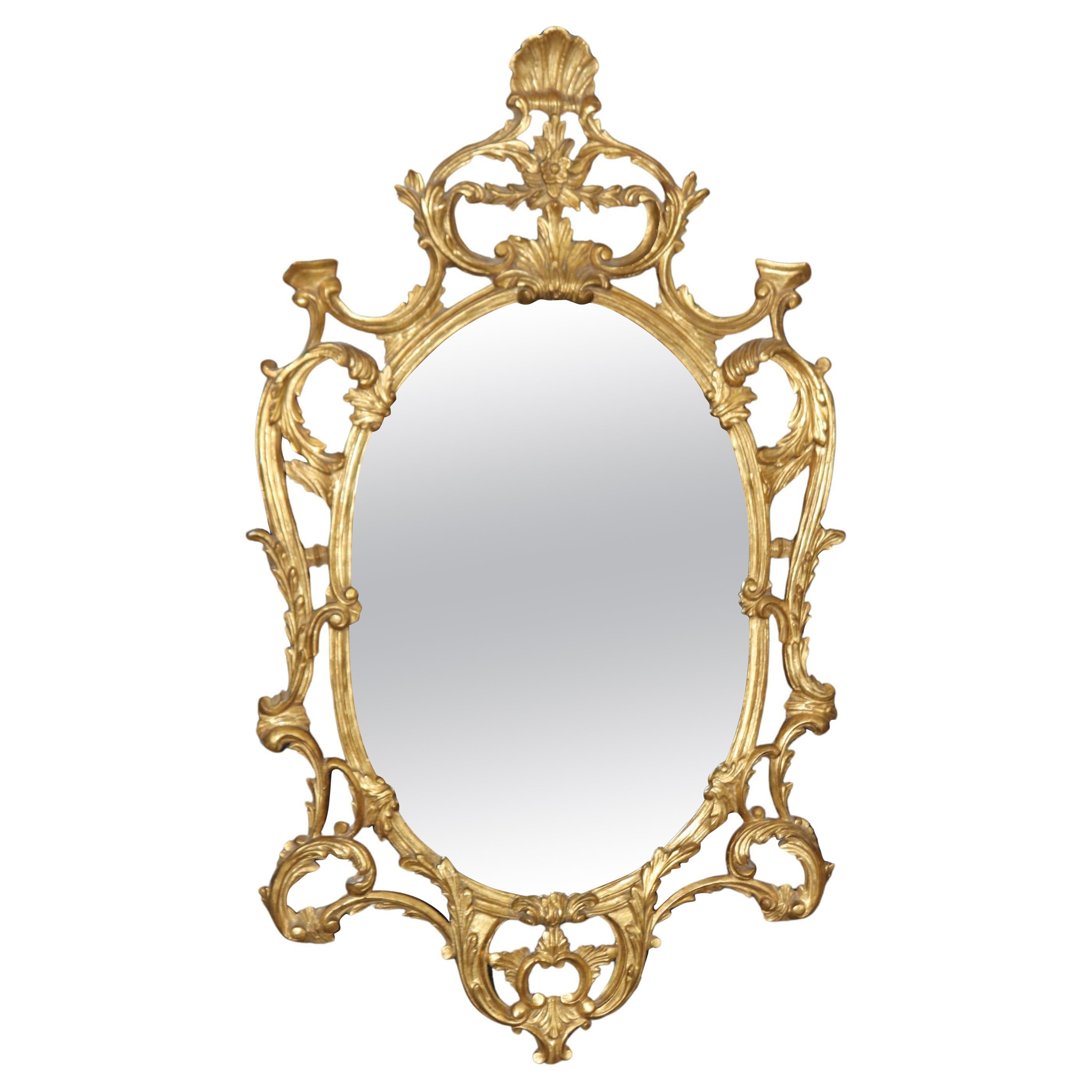 Fine Quality Carved Italian Giltwood Mirror with Shell Motif Atop.  For Sale