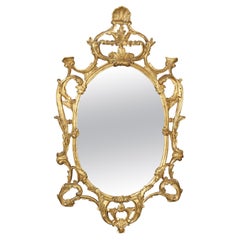 Fine Quality Carved Italian Giltwood Mirror with Shell Motif Atop. 