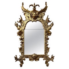 EARLY 18th CENTURY MIRROR WITH VEGETAL MOTIF