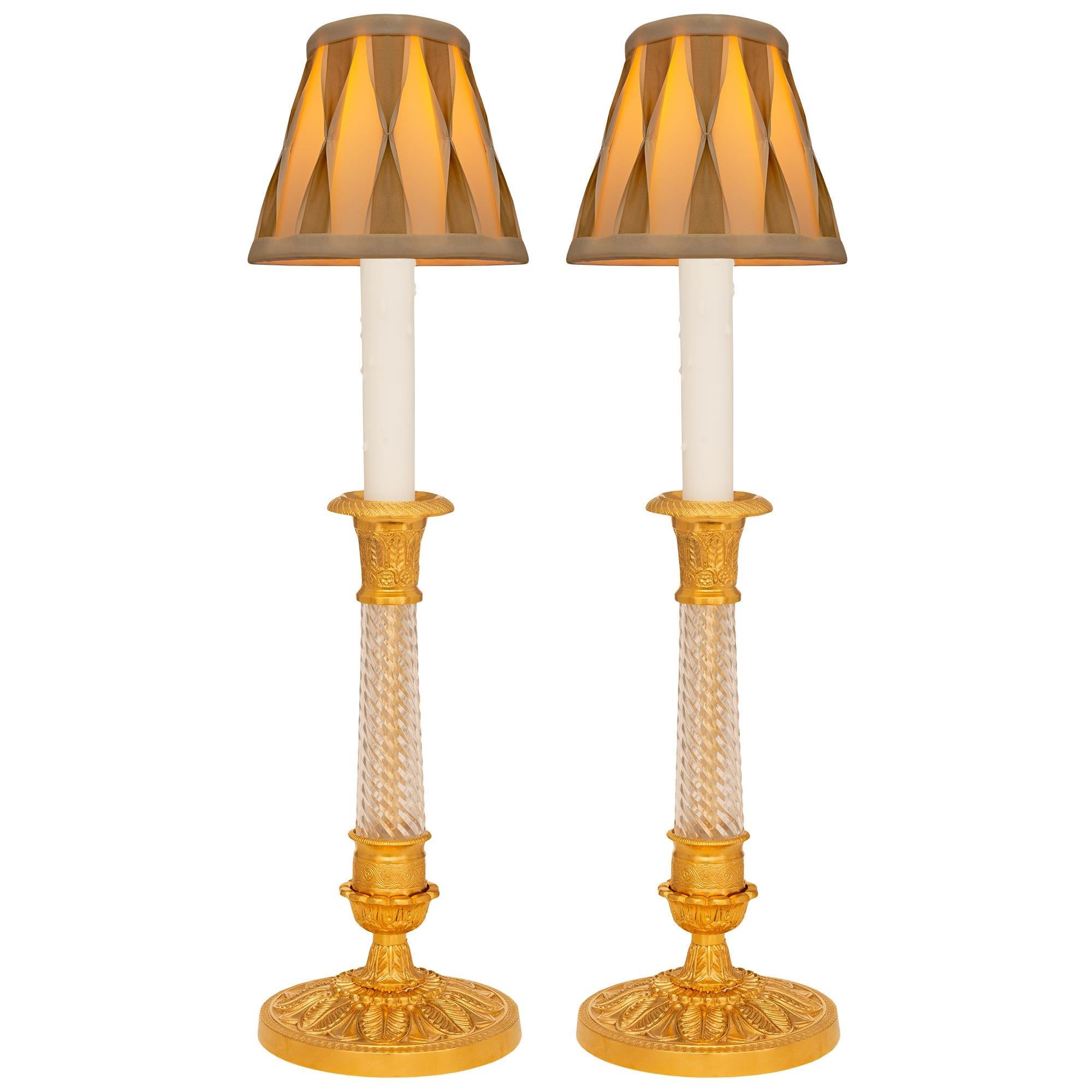 Pair Of French 19th Century Charles X St. Ormolu And Glass Candlestick Lamps For Sale