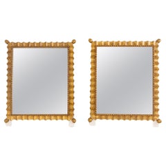 Paire de miroirs muraux festonnés peints en or, milieu du 20e siècle