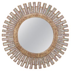 Blue ripple glass and resin geometric form mirror.