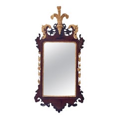 An 18th Century Mahogany and parcel gilt wall mirror.