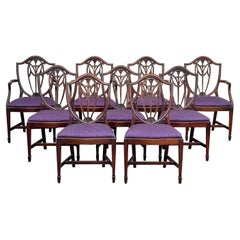 Satz von neun geschnitzten Vintage-Esszimmerstühlen im Sheraton-Stil mit Schilfrohrrückenlehne