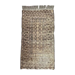 Vintage Bobyrug’s pretty faded mid century Baluch rug 