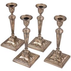 Set of Four English Sterling Silver Adam Style Candlesticks
