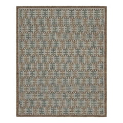 Rug & Kilim è un tappeto in stile scandinavo con motivi geometrici beige-marrone e verde acqua.