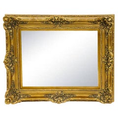 Antique Miroir suspendu avec cadre en bois doré sculpté