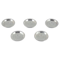 Georg Jensen. Set of five bottle coasters in sterling silver. Rare model.
