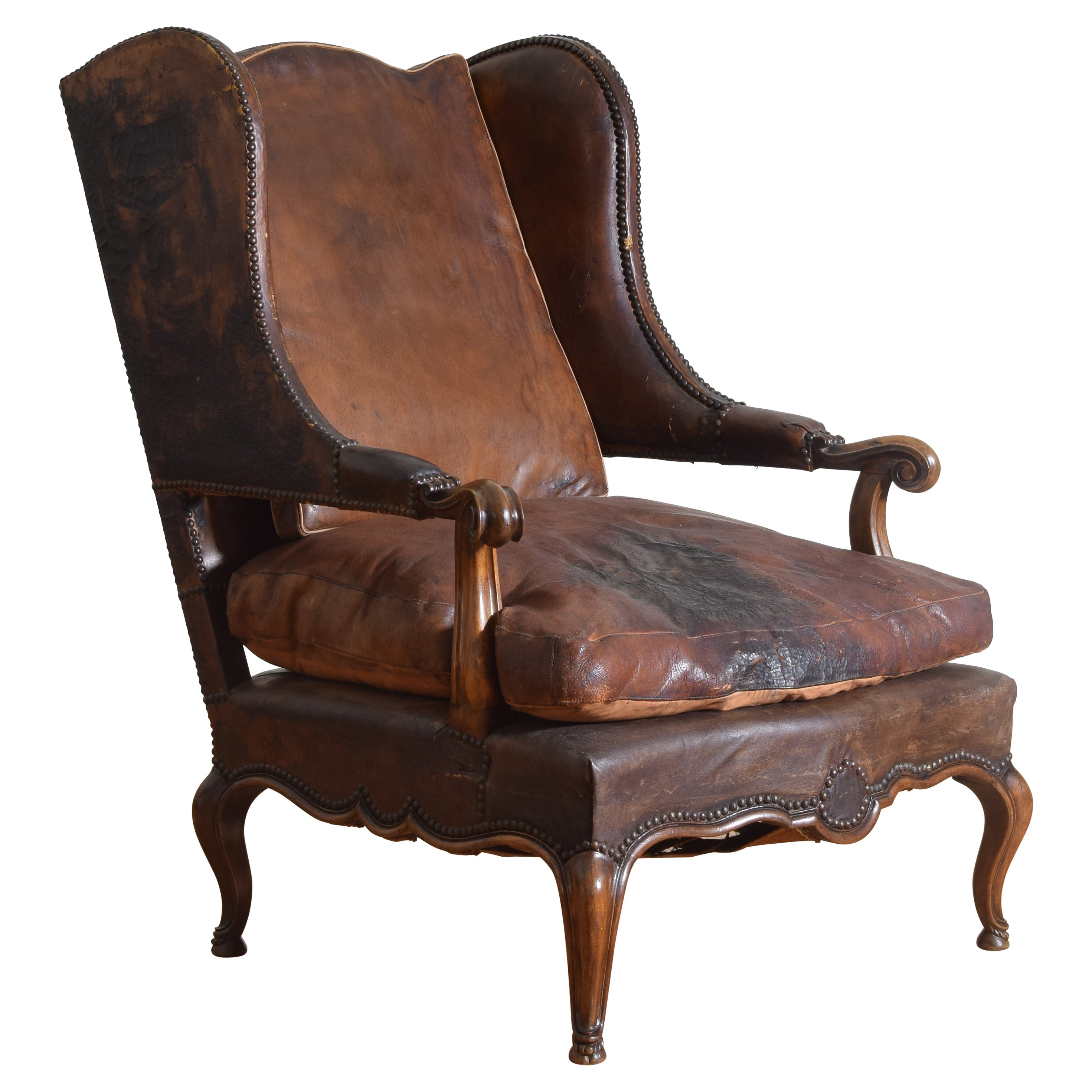 Italian, Savoy, Carved Walnut & Leather Upholstered Bergere, 18th century For Sale