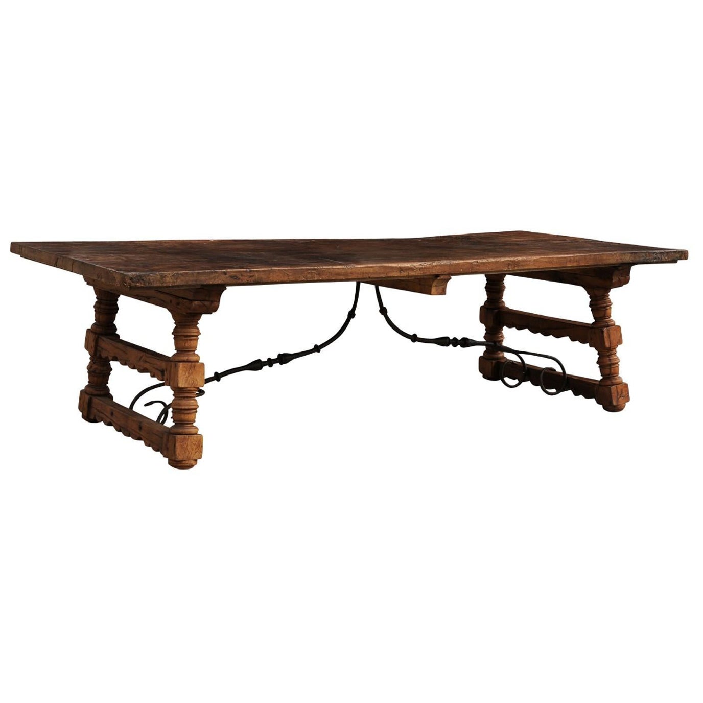 A Robust Italian 9.5 Ft Long Dining Table w/Carved Trestle Legs & Iron Stretcher For Sale