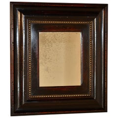 Miroir vintage avec large cadre moulé