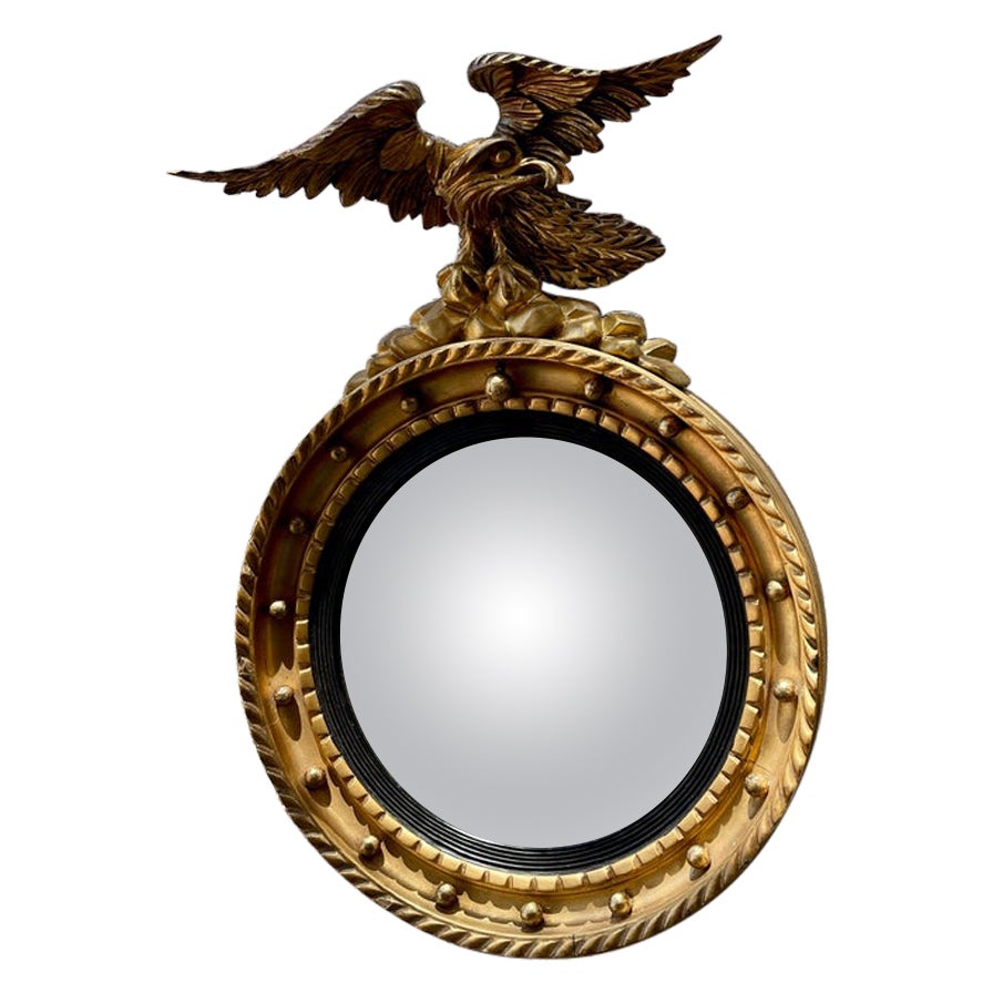 Small English convex mirror with eagle gold gilt 20th century  For Sale