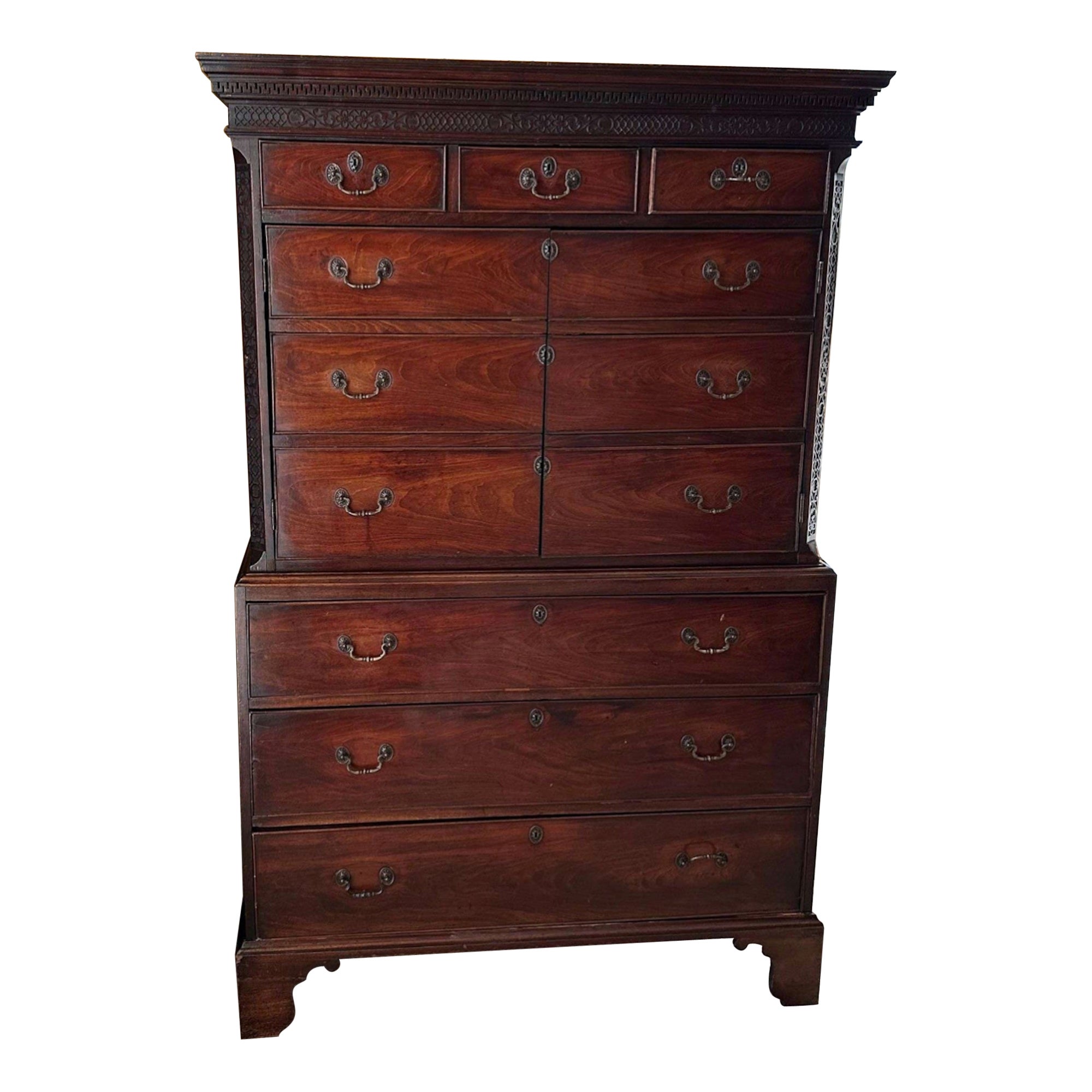 A George III mahogany chest on chest with applied blind fretworadpated as a bar.