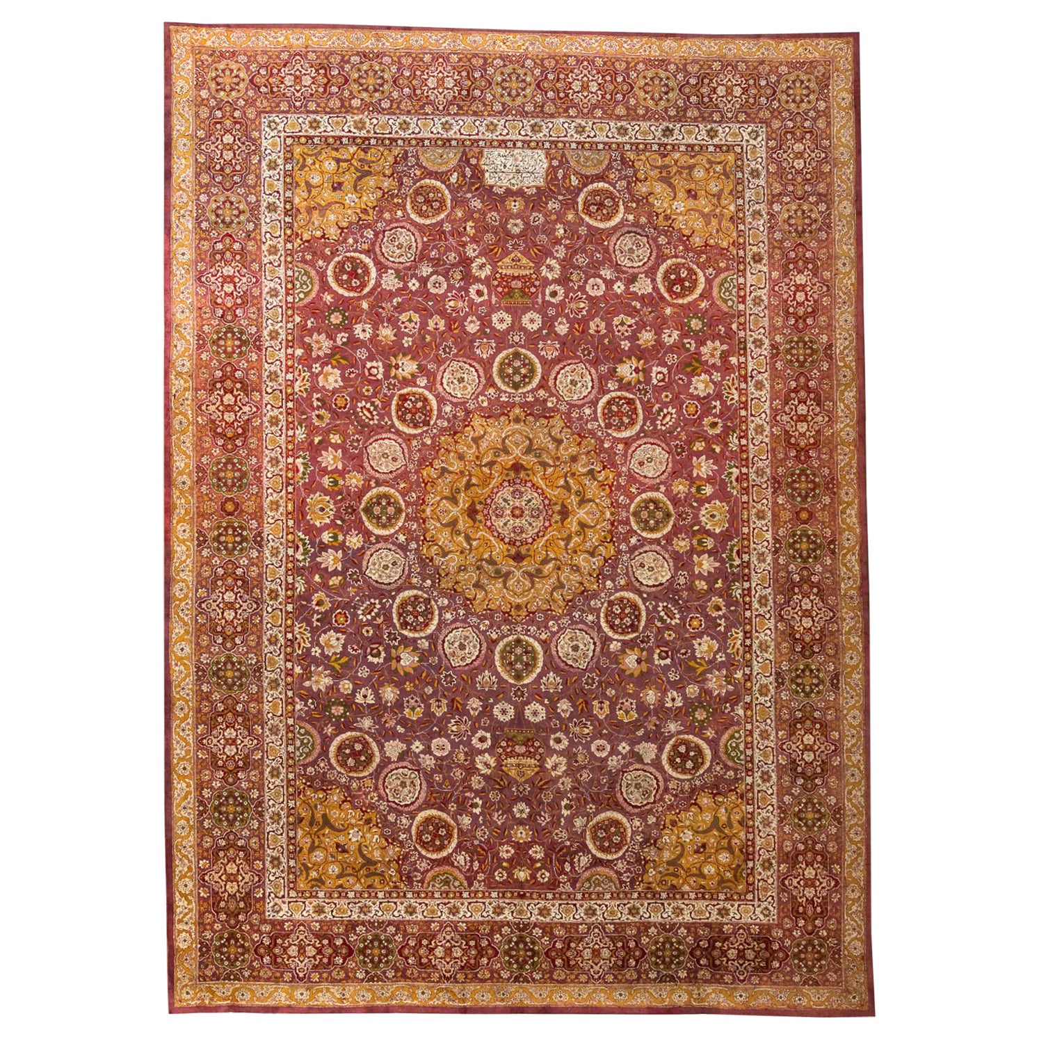 Agra - North India

This is a 120-year-old monumental Agra rug in excellent condition. This piece was inspired by the famous Persian rug, Ardabil, made in the 16th Century for the Persian court. The main field of the rug is woven in marsala. Sixteen