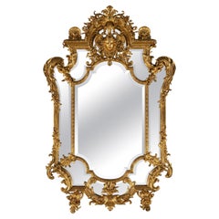 Grand et impressionnant miroir en bois doré sculpté de style Régence du 19e siècle français