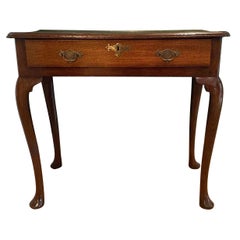 Antique A George III side table in quarter sawn oak with a single drawer and pad feet. 