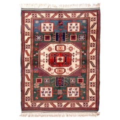 Rug & Kilim's New Kazak Transitional Red and Green Wool Rug with Horn Motifs (en anglais seulement)