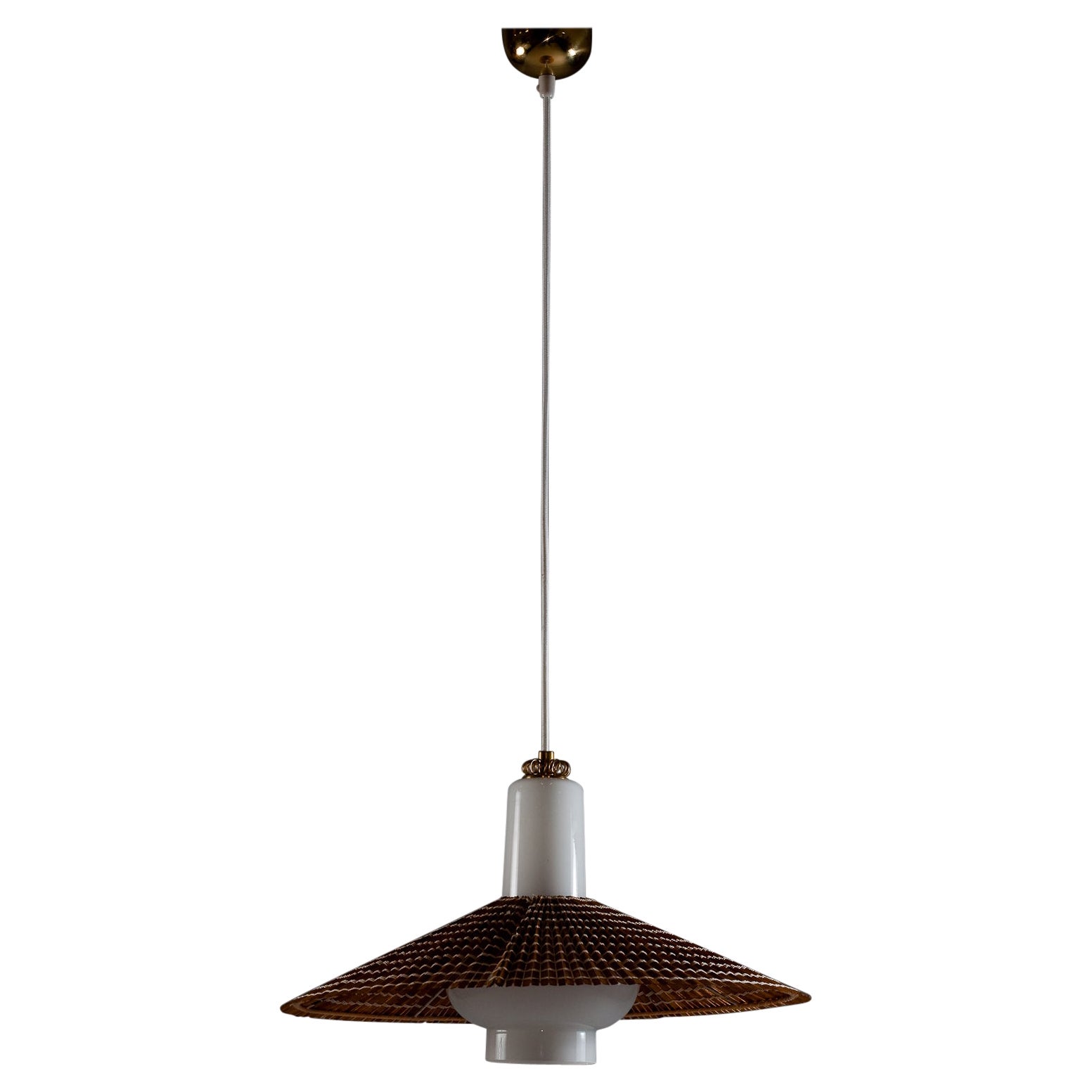 Illuminate your space with the timeless elegance of this 1950's opaline glass pendant by the iconic Paavo Tynell for Idman Oy. The pendant features a wooden slat shade that adds a touch of rustic charm to its design. The opaline glass casts a warm