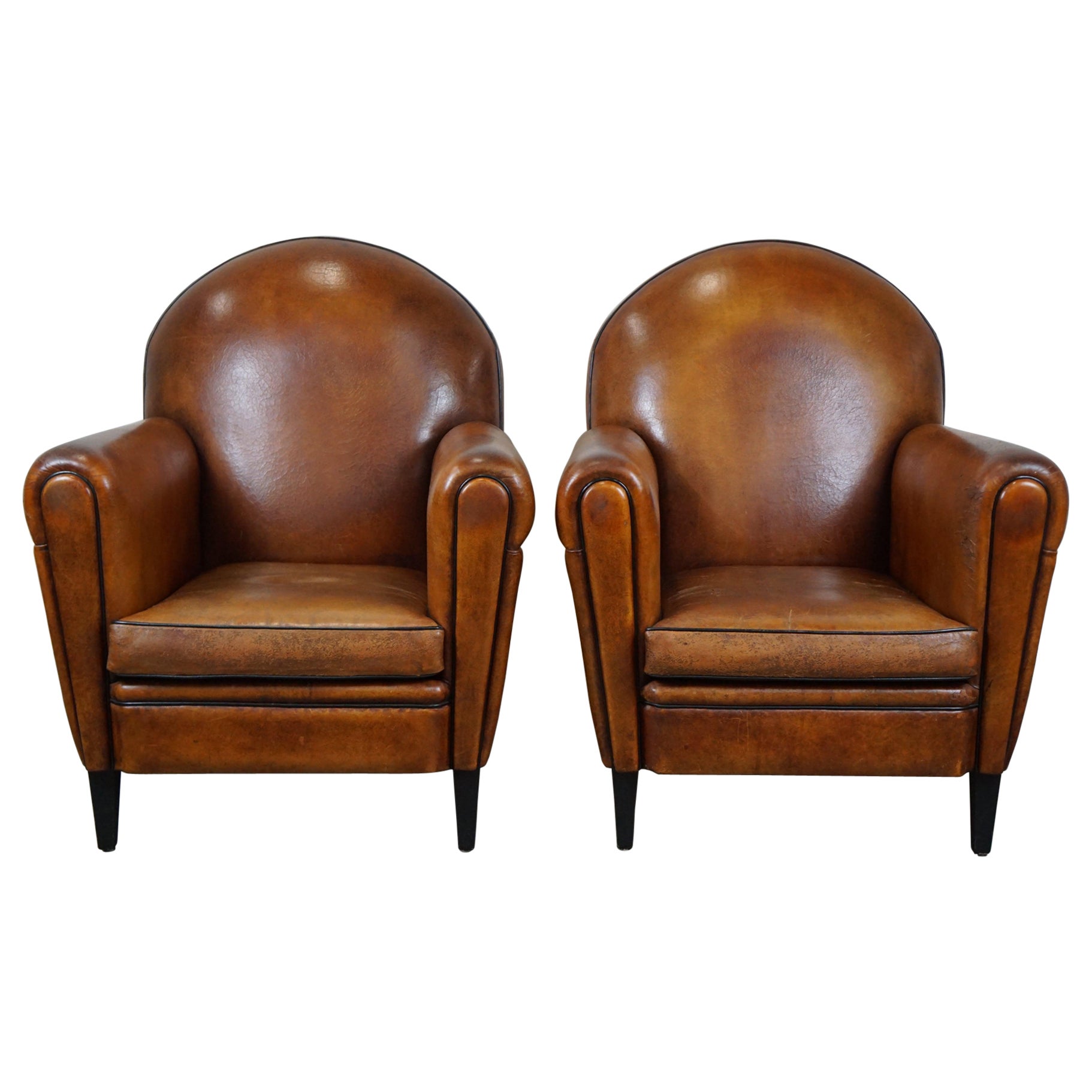 Set of two sheep leather Art Deco style design armchairs with a beautiful patina For Sale