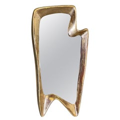 Vintage Italian Art Deco golden wood wall mirror with abstract curved structure, 1940s