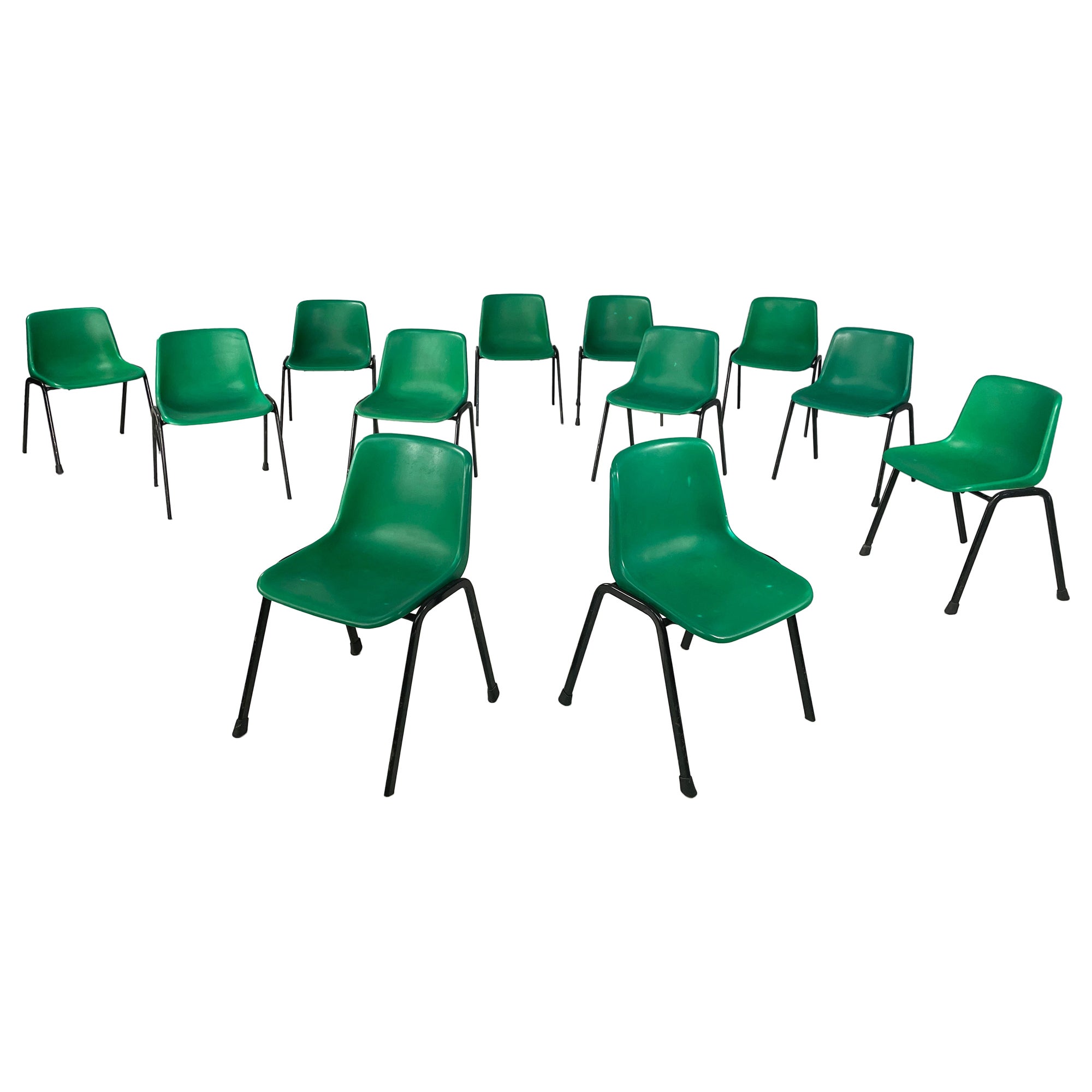Italian modern Stackable chairs in green plastic and black metal, 2000s For Sale
