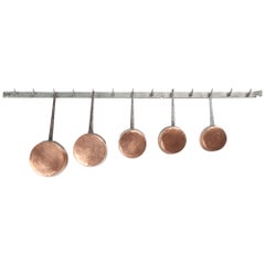 Used French Set of (5) Graduated Copper Pans Mounted on Old Butcher's Rack