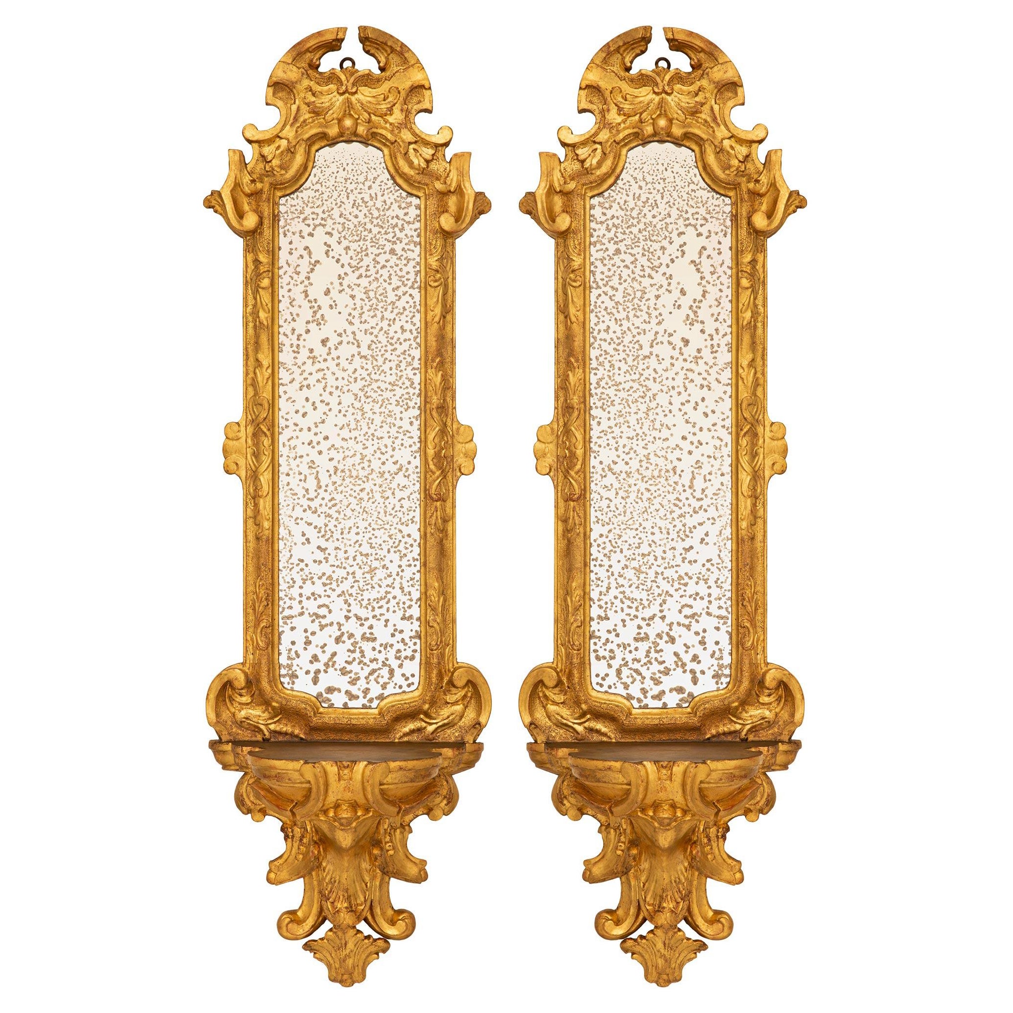 pair of Italian 17th century Baroque period Giltwood mirrored wall brackets For Sale