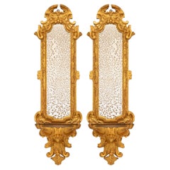 Antique pair of Italian 17th century Baroque period Giltwood mirrored wall brackets