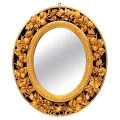 Miroir italien du début du 19e siècle en bois doré et velours noir