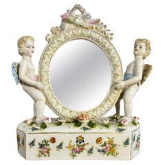 Joli miroir de coiffeuse antique en porcelaine