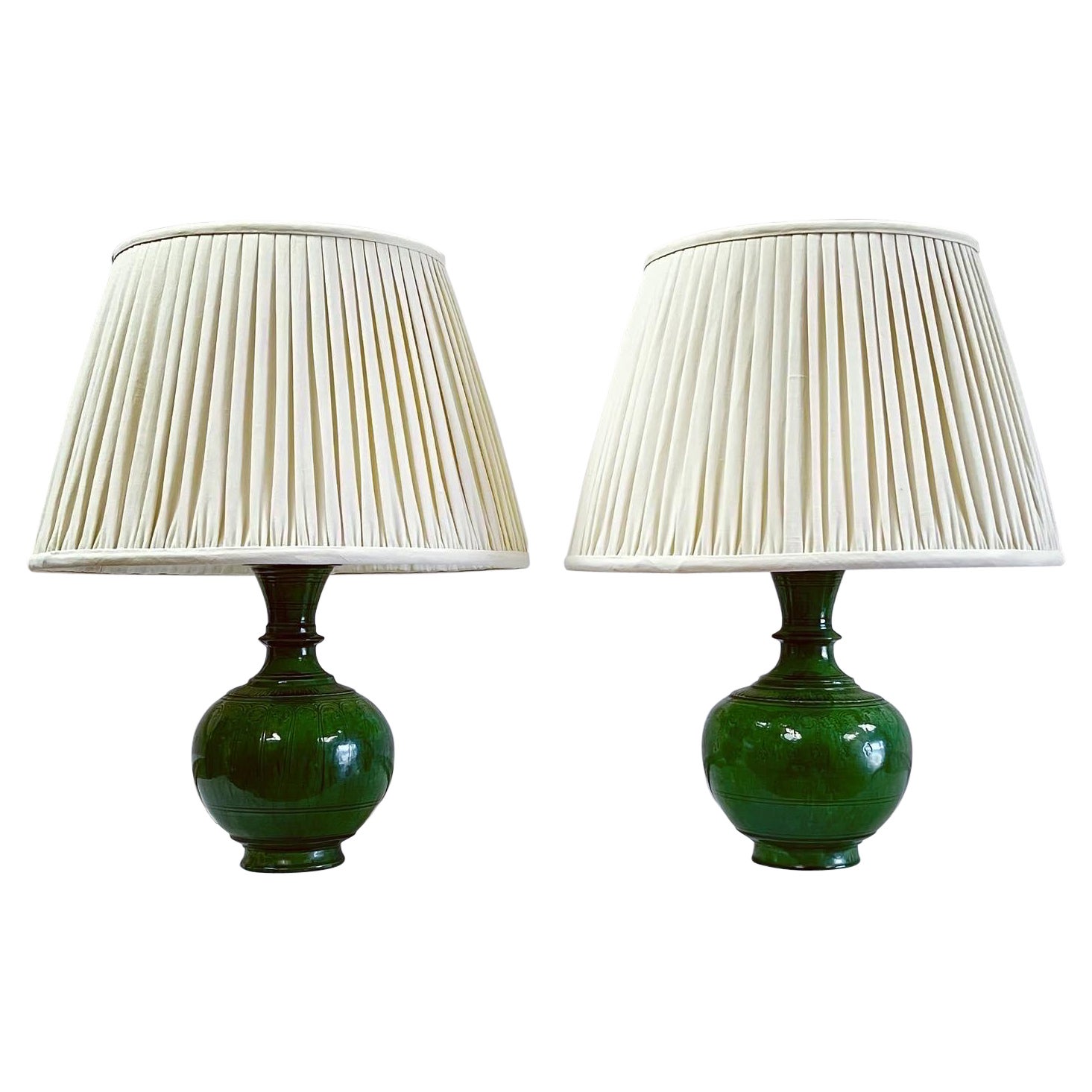 A Pair of Persian Green Glazed Ceramic Lamps For Sale