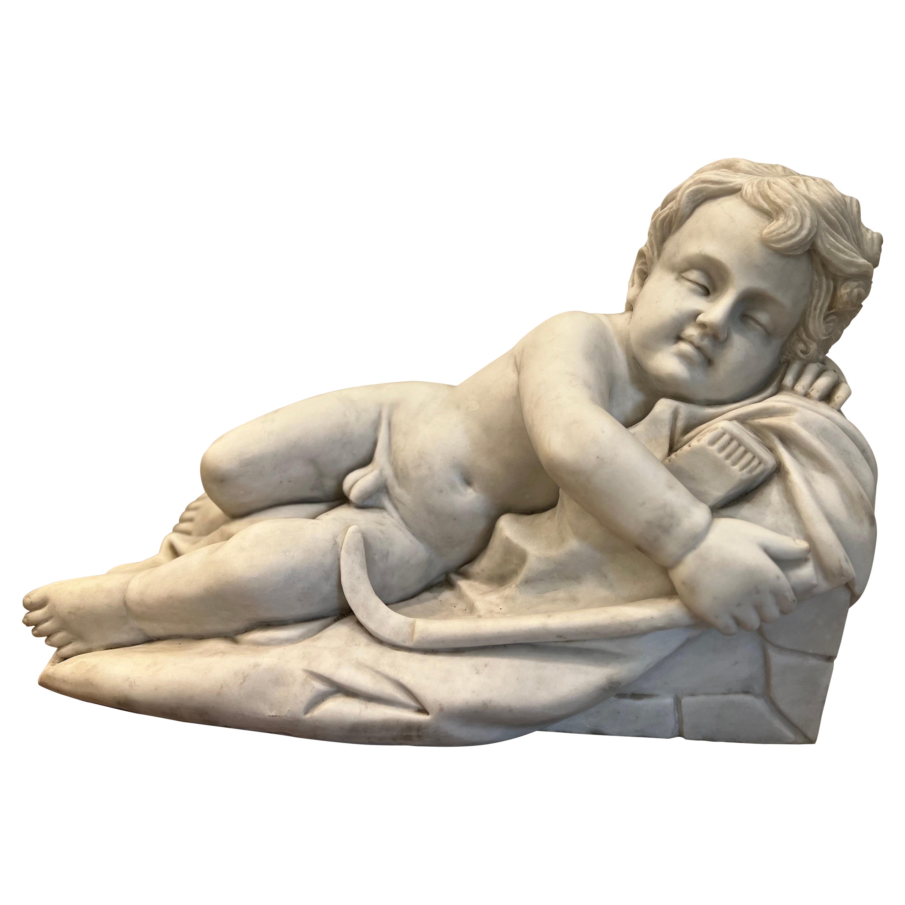 Marble sleeping Cupid Statue in the style of François Duquesnoy For Sale