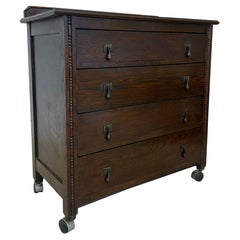 Retro Four Drawer Dresser on Casters With Carved Wood Detailing.