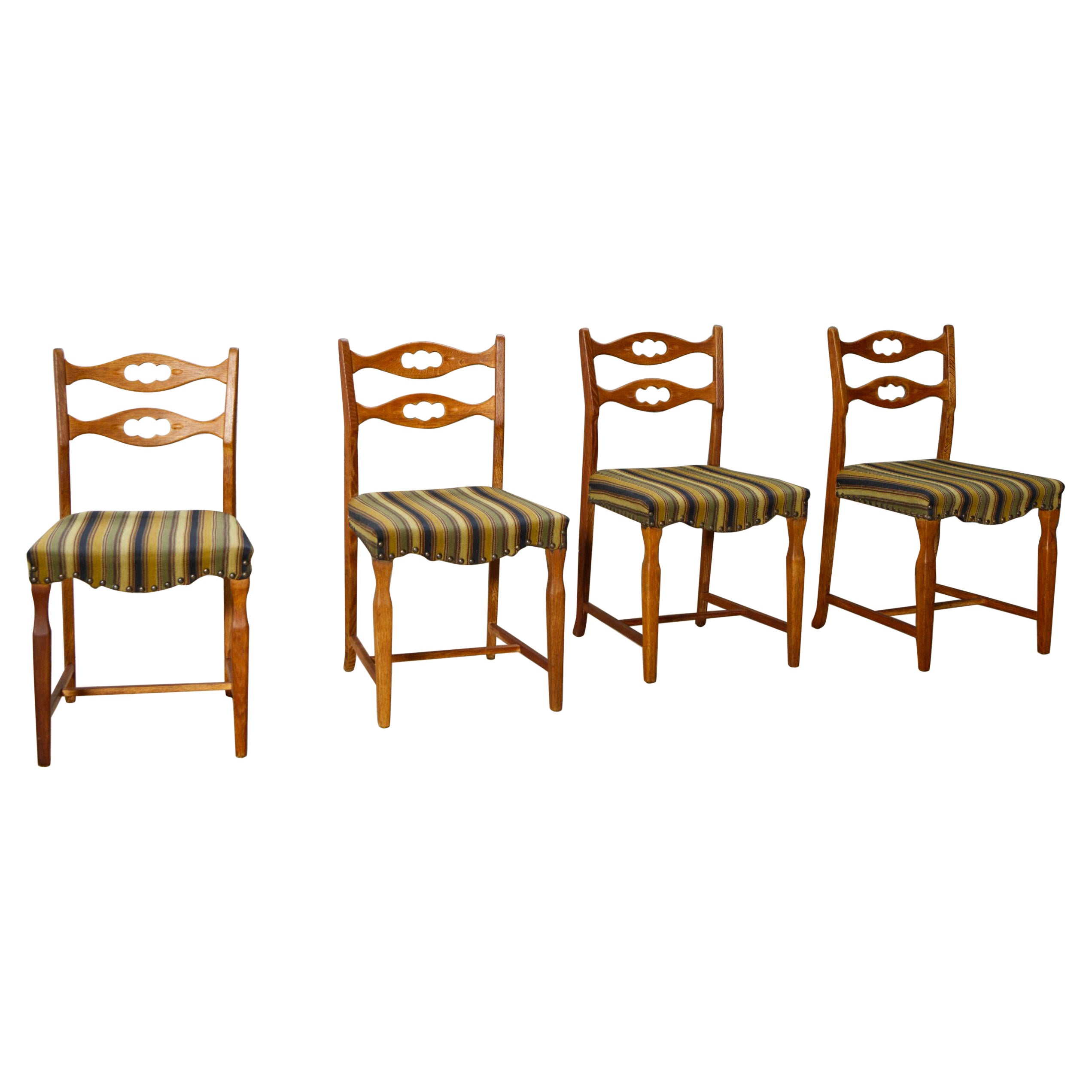 Set of four oak and wool dining room chairs by Henning Kjaernulf, 1960's For Sale