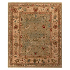 Alfombra estilo Oushak de Rug & Kilim con motivos florales en azul, rojo y beige-marrón