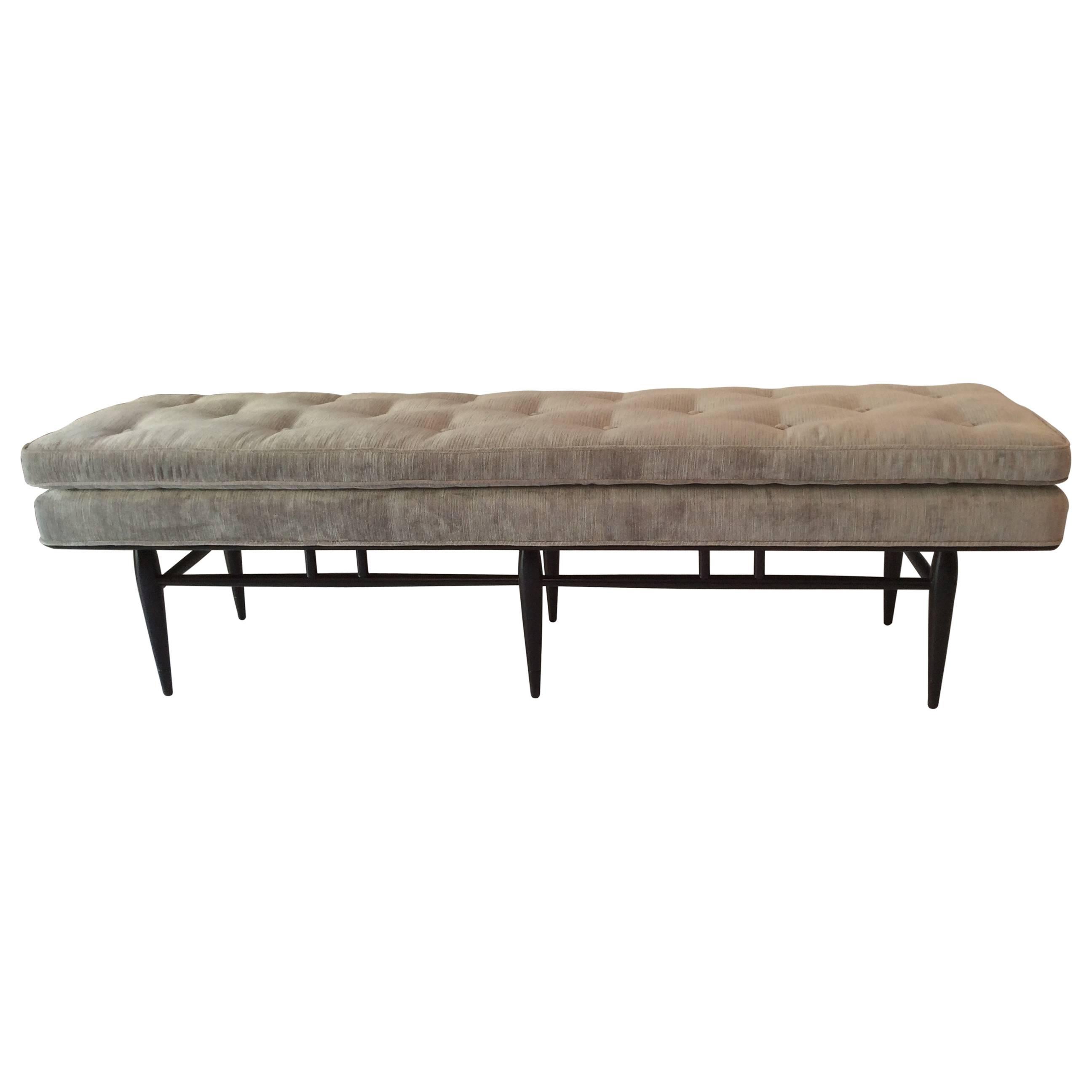 Hard to find long button tufted Mid-Century bench. Newly re-upholstered in silver gray velvet fabric by Romo. Walnut frame newly refinished in rich chocolate brown stain. Great in an entry way or at the foot of a bed.
