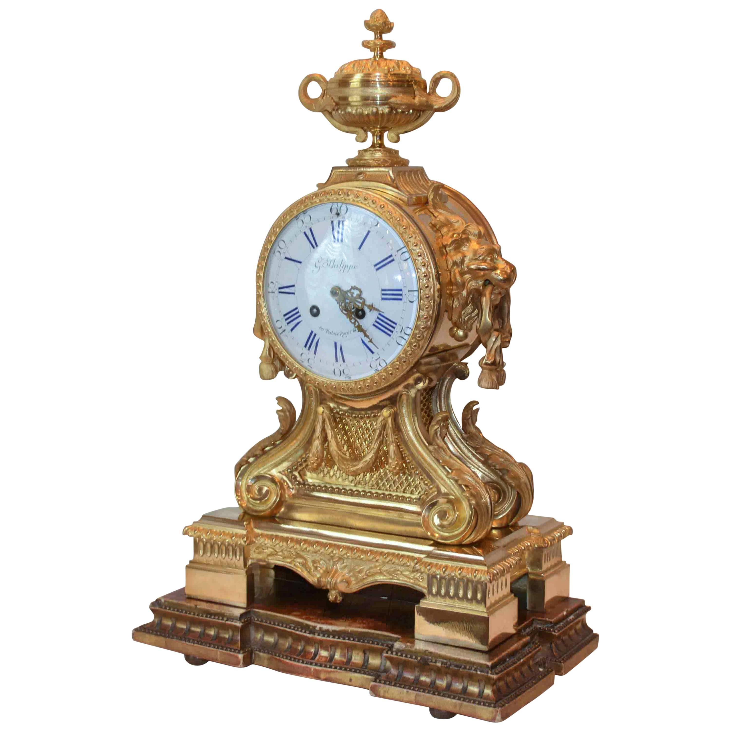Louis XVI-Style Lion's Head Clock by G. Philippe For Sale