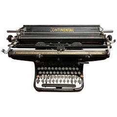 Máquina de escribir grande portátil del siglo XX Continental made in Germany